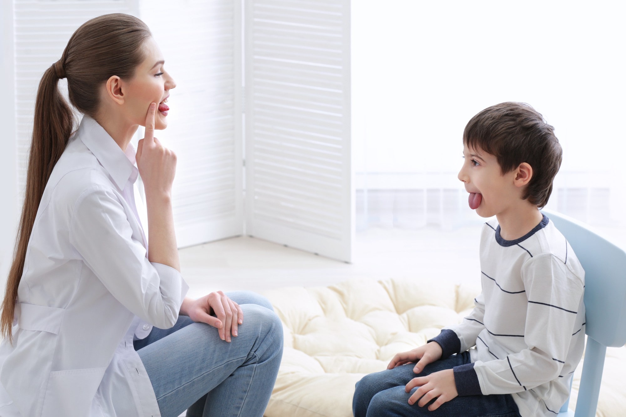Speech Therapist Giving Therapy to a Child